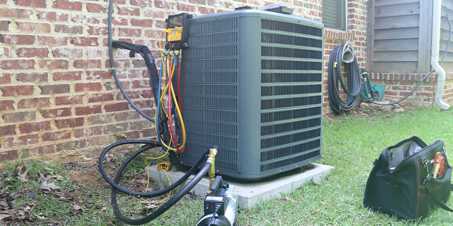 Air conditioner hooked up to monitoring devices to test performance