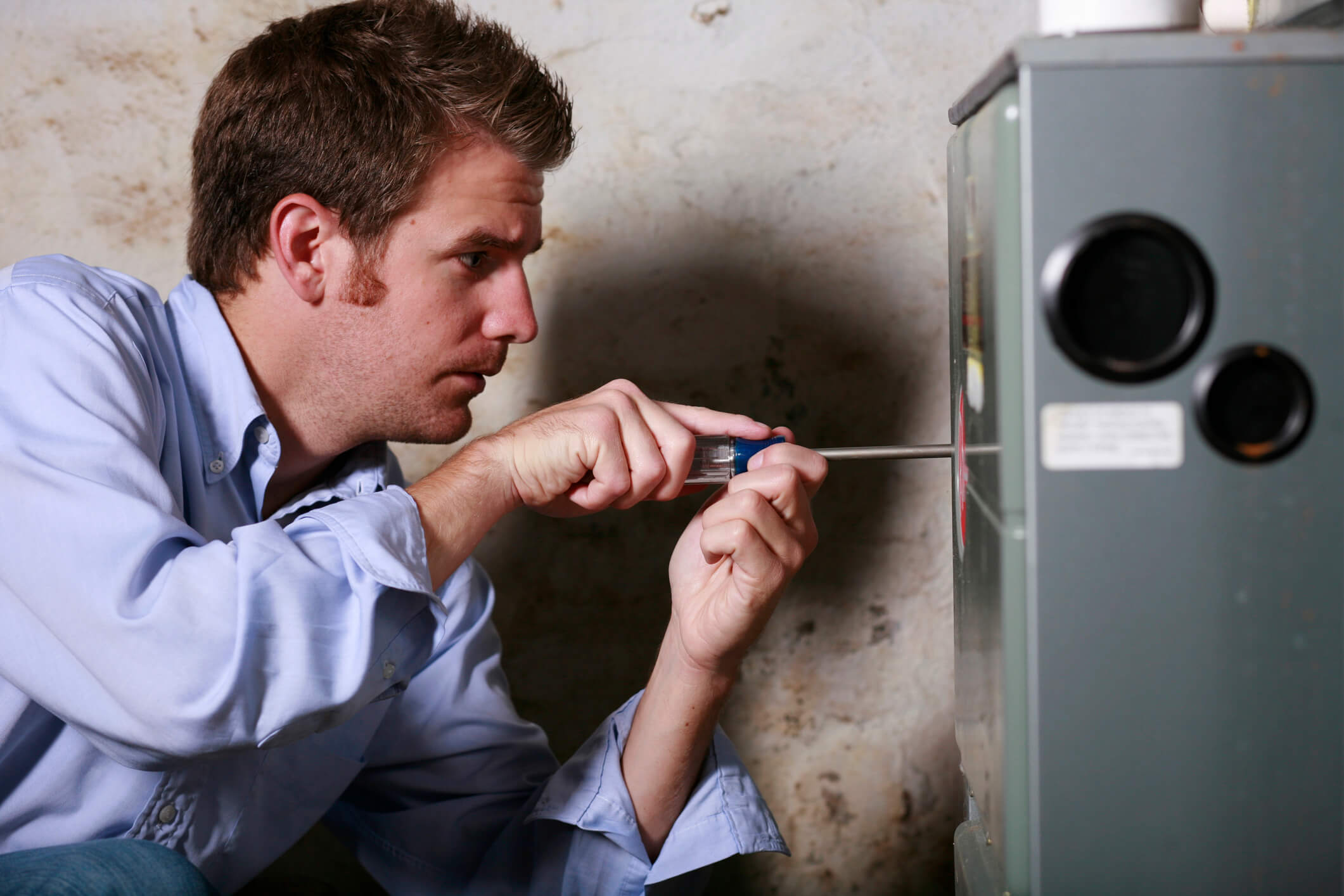 Comfort Service tech working on installing a furnace