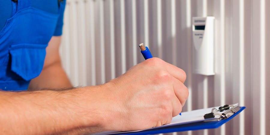 Man Inspecting Heater